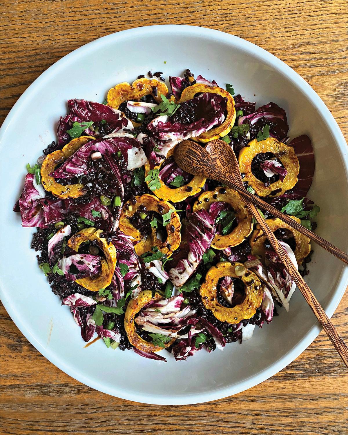 This vibrant salad is layered with toothsome nutty black rice, juicy-crisp radicchio leaves, and spice-roasted delicata squash rings. (Lynda Balslev for Tastefood)