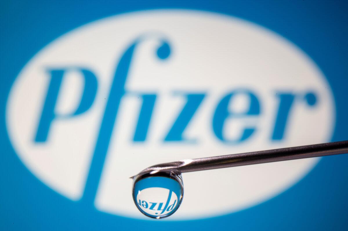 Pfizer's logo is reflected in a drop on a syringe needle in this illustration taken on Nov. 9, 2020. (Dado Ruvic/Illustration/Reuters)
