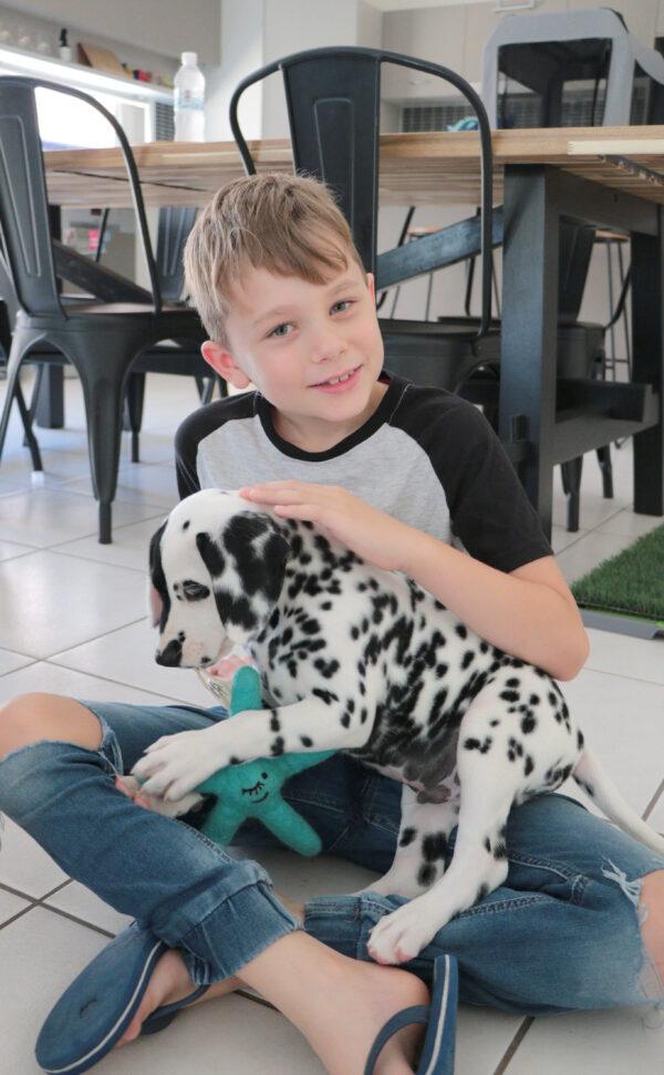 Ethan with his pet dog, Rorschach. (Caters News)