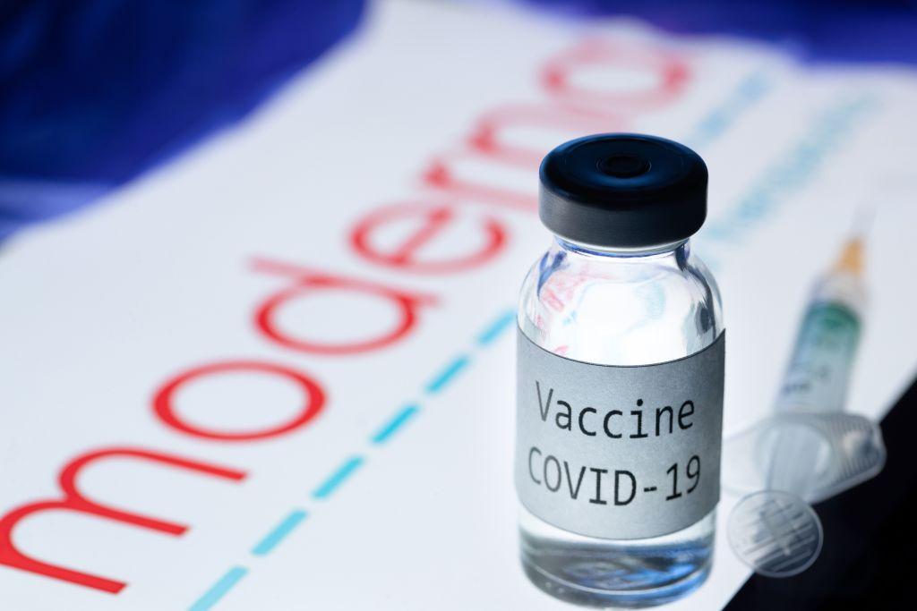  A picture of a syringe and a bottle reading "Vaccine COVID-19" next to the Moderna biotech company logo on Nov. 18, 2020. The CEO of Moderna warned European countries on November 17 that dragging out negotiations to purchase its new Covid-19 vaccine will slow down deliveries, as other nations that have signed deals will get priority. (Joel Saget/AFP via Getty Images)