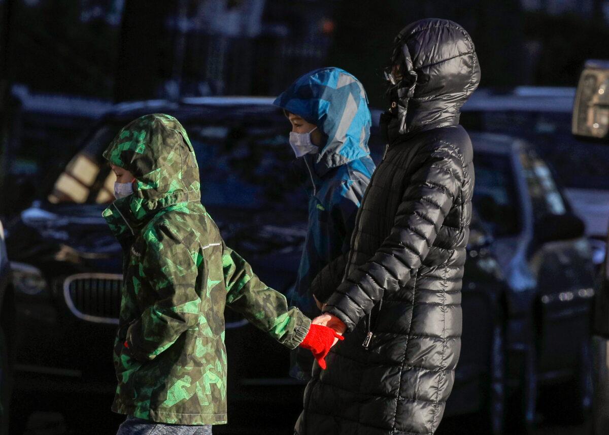 Students exit a school following the announcement to close New York City public schools, in the Brooklyn borough of New York City on Nov. 18, 2020. (Brendan McDermid/Reuters)