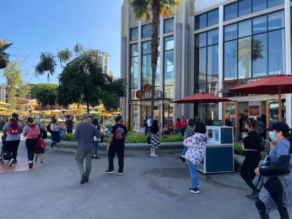 Guests stroll down newly reopened Buena Vista Street, an extension of the Downtown Disney District, in Anaheim, Calif., on Nov. 19, 2020. (Drew Van Voorhis/The Epoch Times)