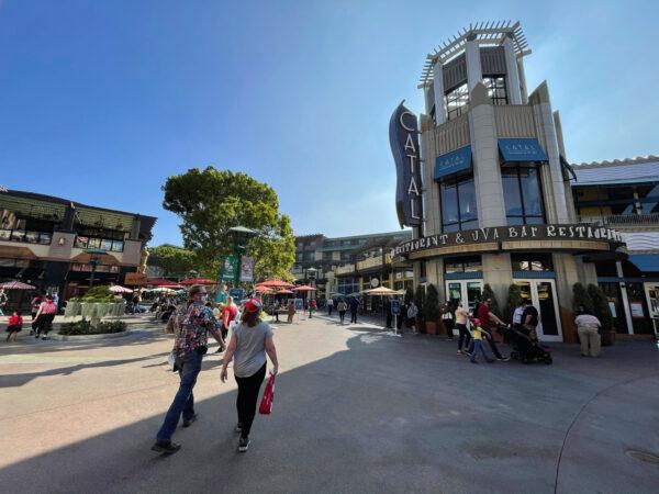 Guests stroll down newly reopened Buena Vista Street, an extension of the Downtown Disney District, in Anaheim, Calif., on Nov. 19, 2020. (Drew Van Voorhis/The Epoch Times)