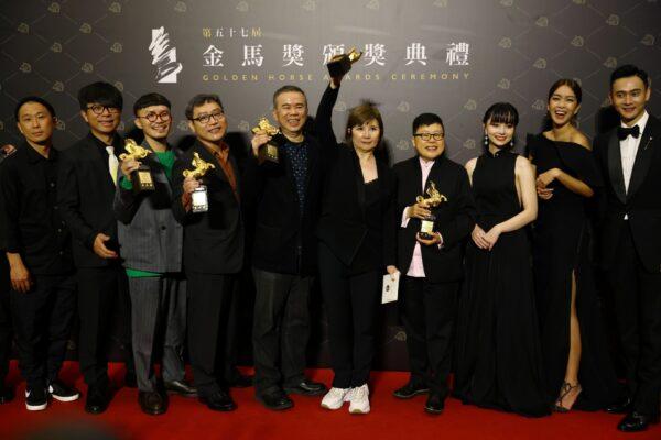 Director Chen Yu-hsun and others pose with the Best Narrative Feature award for "My Missing Valentine" at the 57th Golden Horse Awards in Taipei, Taiwan, Nov. 21, 2020. (Ann Wang/Reuters)