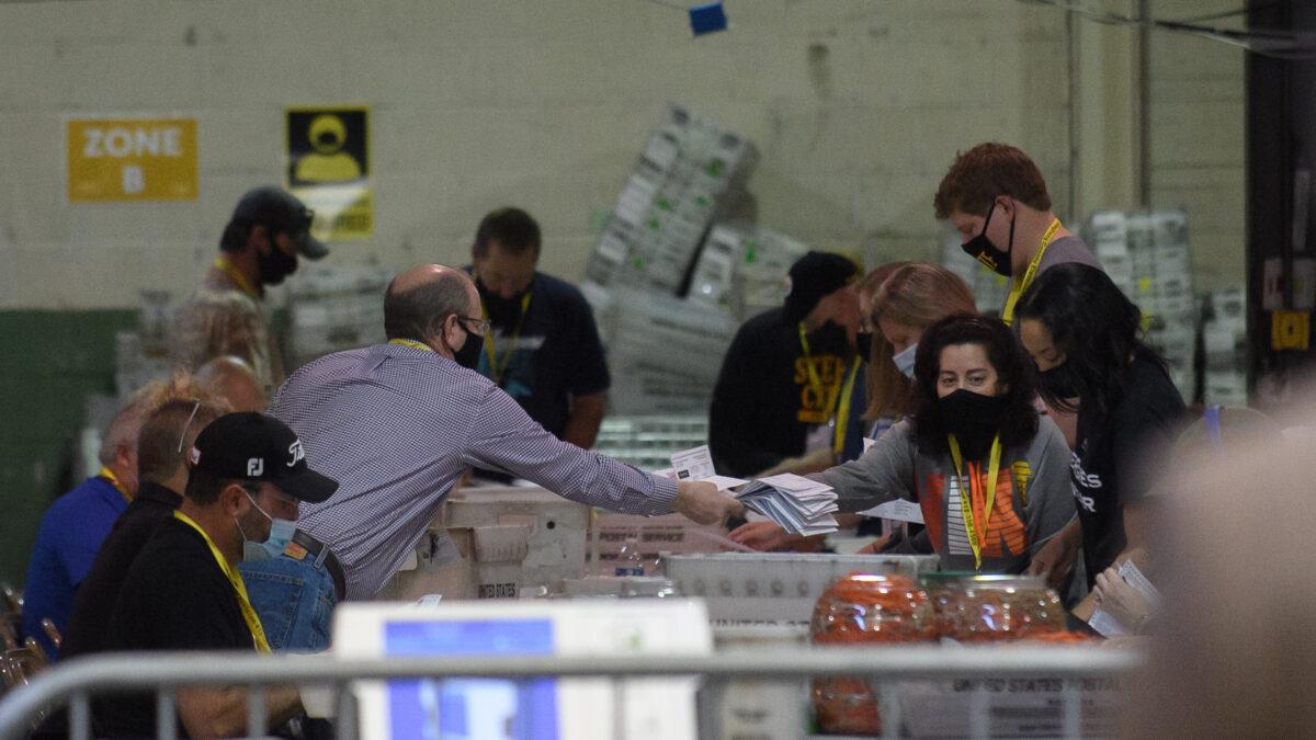 Allegheny County election employees organize ballots at the Allegheny County elections warehouse in Pittsburgh, Pa., on Nov. 7, 2020. (Jeff Swensen/Getty Images)
