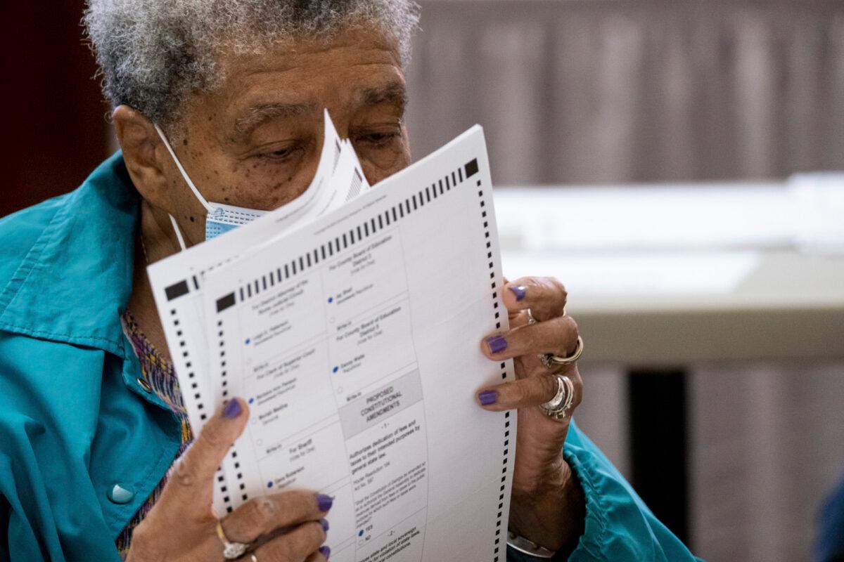  An official sorts ballots during an audit at the Floyd County administration building in Rome, Ga., on Nov. 13, 2020. (Ben Gray/AP Photo)