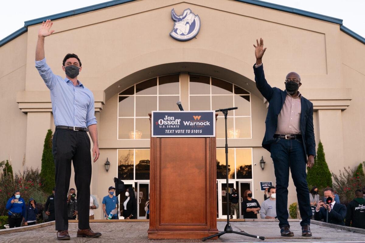 Democratic U.S. Senate candidates Jon Ossoff, left, and Raphael Warnock campaign in Jonesboro, Ga., on Nov. 19, 2020. (Elijah Nouvelage/Getty Images)