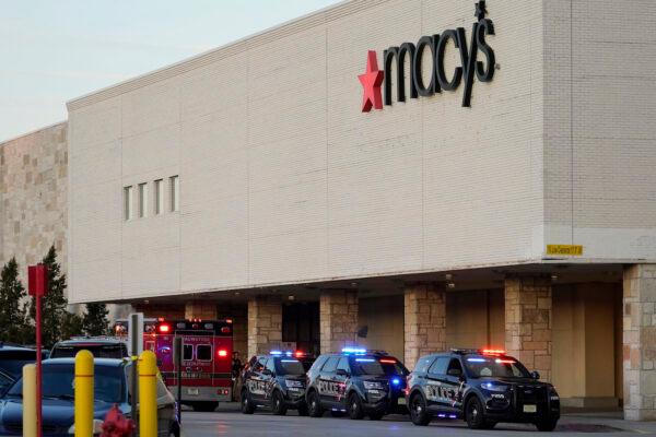 Police vehicles park at the Mayfair Mall, in Wauwatosa, Wis., on Nov. 20, 2020. (AP Photo/Nam Y. Huh)