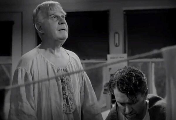 Angel second class Clarence (Henry Travers, L) tries to help the dispirited George Bailey (James Stewart). (RKO Radio Pictures)