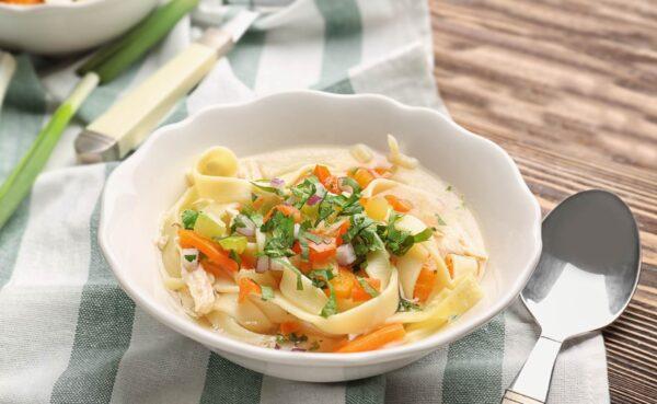 Chicken noodle soup, classic and comforting. (Africa Studio)