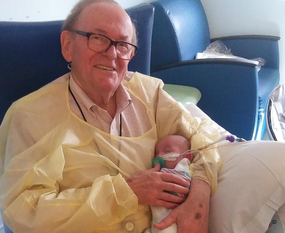 David Deutchman, the "ICU Grandpa," cradles premature infant Logan at Children's Healthcare of Atlanta, Georgia. (Courtesy of Children's Healthcare of Atlanta)