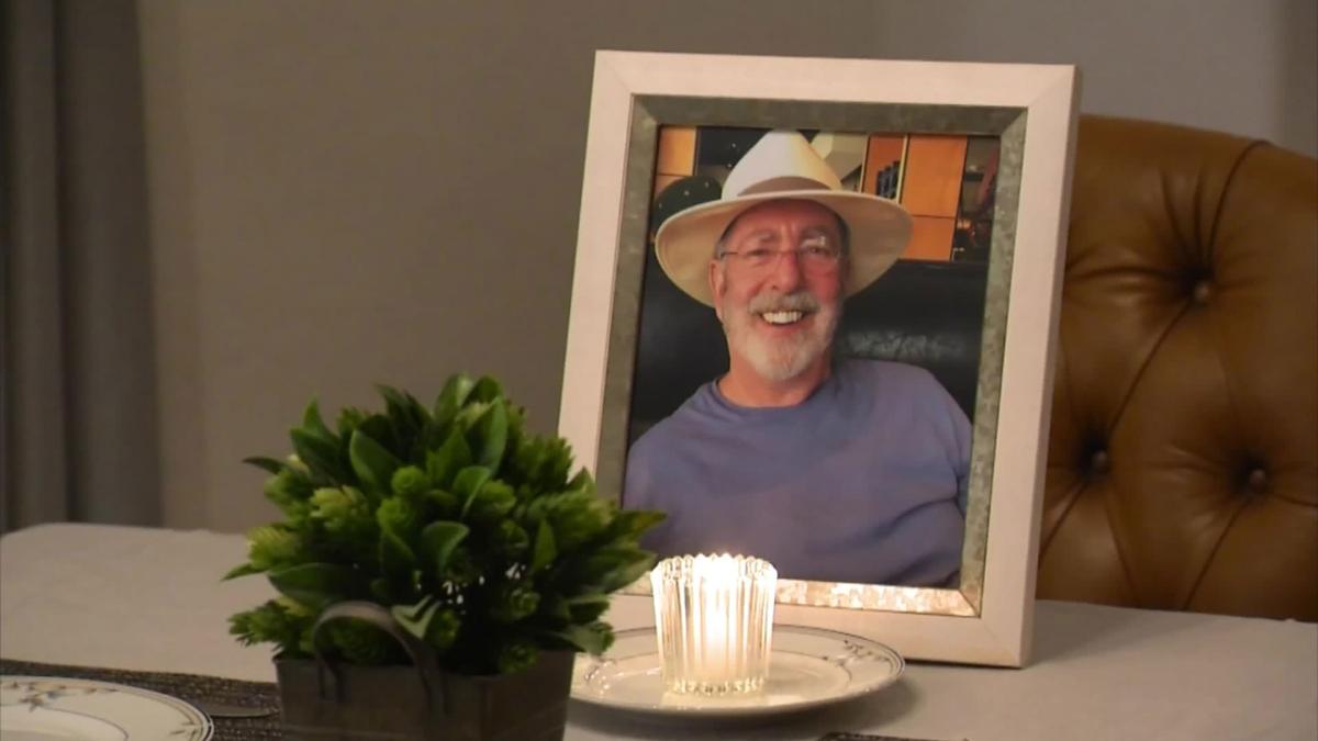 A photo of Lonnie and a candle stood in front of his empty chair during their Thanksgiving dinner this year. (KPHO/KTVK)