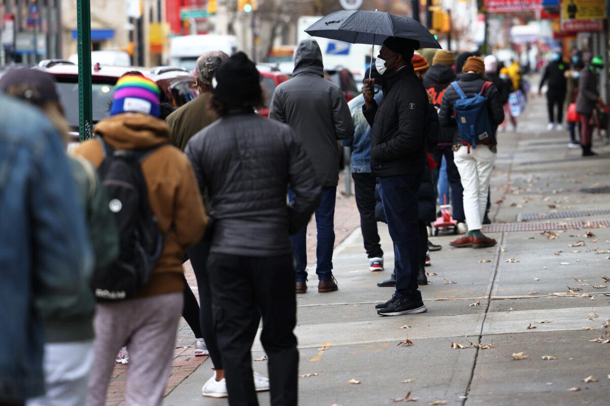 People are seen waiting in line to get COVID-19 testing in New York City on Nov. 23, 2020. (Michael M. Santiago/Getty Images)