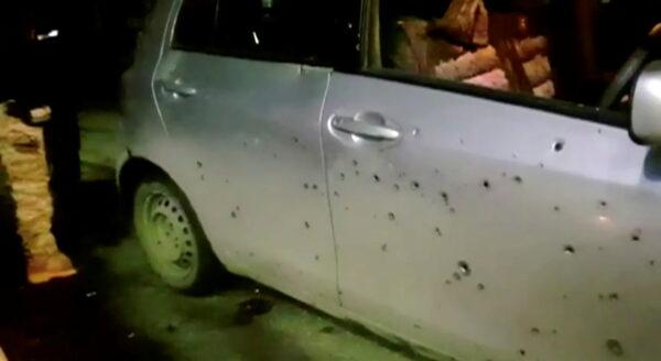 A view of a damaged car with shrapnel marks and blown-out windows following twin explosions in Bamiyan province, Afghanistan Nov. 24, 2020, in this still image taken from video. (1TV/Reuters TV via REUTERS)
