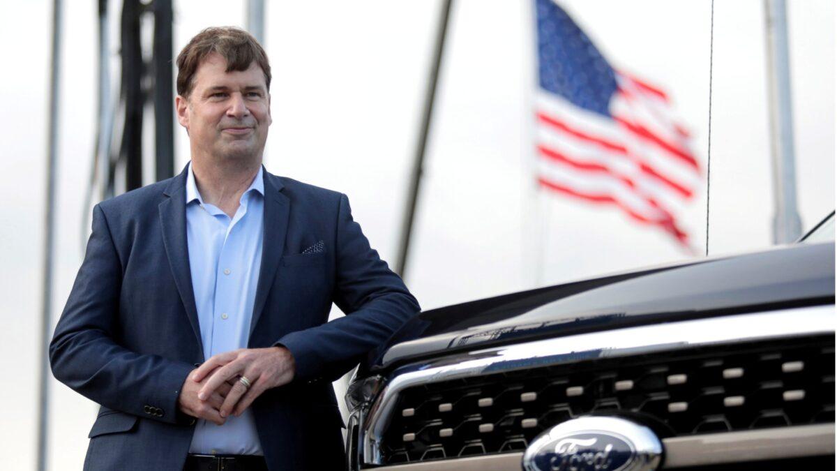 Ford Motor Co. CEO Jim Farley poses next to a new 2021 Ford F-150 pickup truck at the Rouge Complex in Dearborn, Mich., on Sept. 17, 2020. (Rebecca Cook/Reuters)