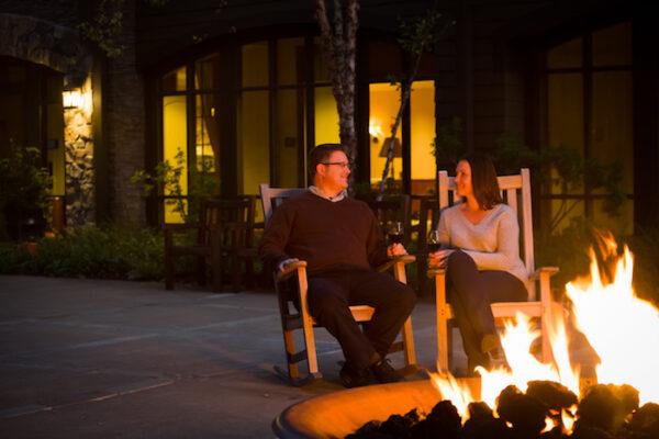 Relaxing with a drink, a fire, and good company. (Courtesy of Woodloch)