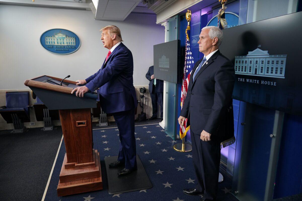 President Donald Trump with Vice President Mike Pence, delivers remarks in the James Brady Press Briefing Room at the White House in Washington on Nov. 24, 2020. (Mandel Ngan/AFP via Getty Images)