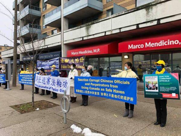 Falun Gong adherents hold an event outside Immigration Minister Marco Mendicino's constituency office in Toronto on Nov. 25, 2020, to call on the government to refuse immigration or visitor visas to Chinese officials involved in the persecution campaign against the spiritual group in China. (Handout)
