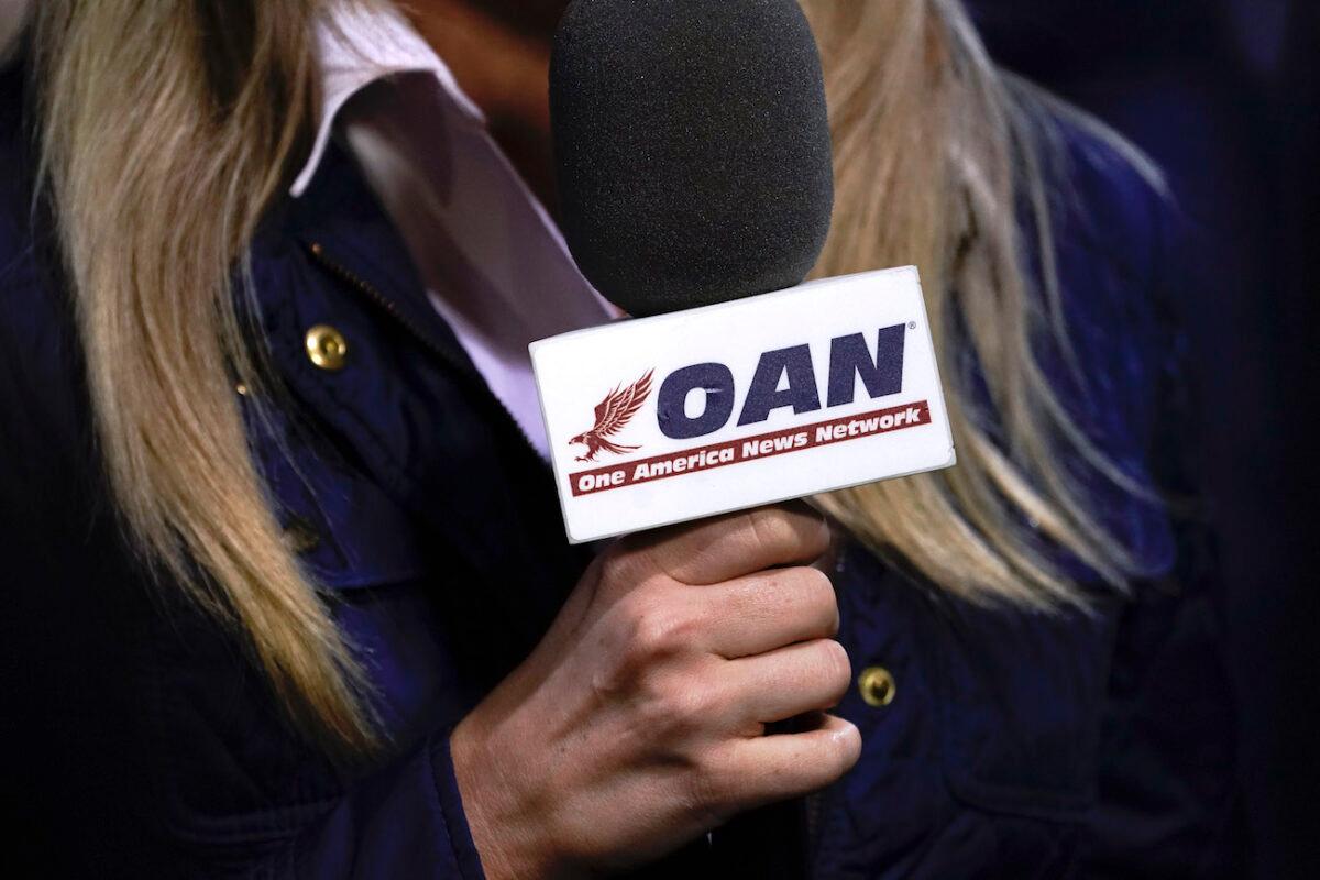 A reporter with One America News Network at a campaign rally with President Donald Trump at Williamsburg International Airport in Newport News, Va., on Sept. 25, 2020. (Drew Angerer/Getty Images)
