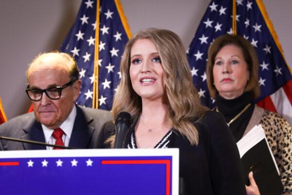 Then-President Donald Trump campaign senior legal adviser Jenna Ellis speaks to media while flanked by Trump lawyer and former New York City Mayor Rudy Giuliani (L) and Sidney Powell, at a press conference at the Republican National Committee headquarters in Washington on Nov. 19, 2020. (Charlotte Cuthbertson/The Epoch Times)