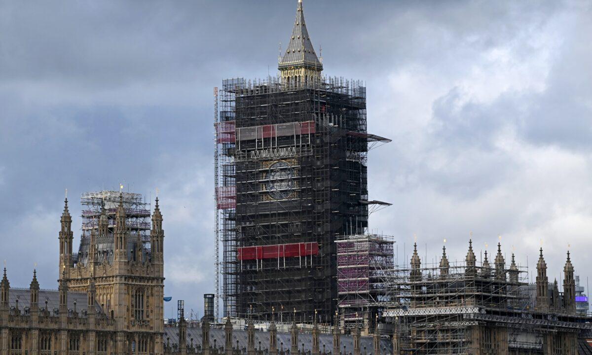 Scaffolding surrounds the newly revealed restored spire of the Elizabeth Tower, commonly known by the name of the bell Big Ben, at the Palace of Westminster, home to the Houses of Parliament, in London on Oct. 6, 2020. (Daniel Leal-Olivas/AFP via Getty Images)