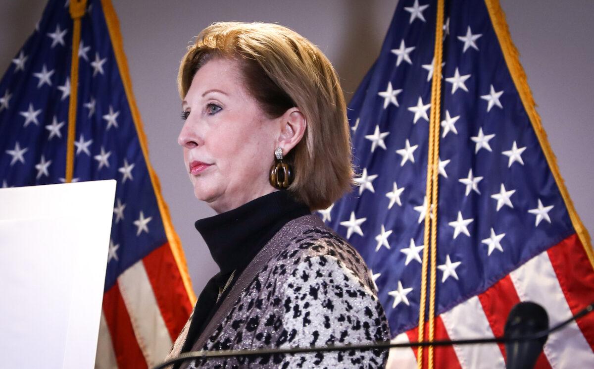 Lawyer Sidney Powell departs a press conference at the Republican National Committee headquarters in Washington, on Nov. 19, 2020. (Charlotte Cuthbertson/The Epoch Times)