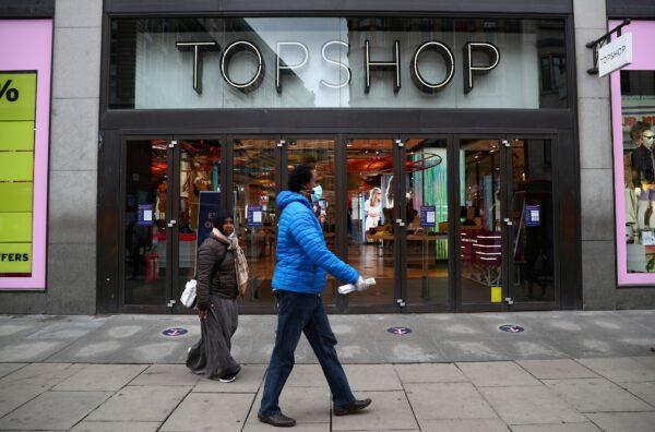 People walk past an entrance to the Topshop store at the Oxford Street, in London, on July 2, 2020. (Hannah McKay/File Photo/Reuters)