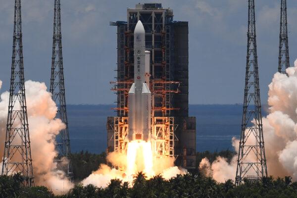 A Long March-5 rocket, carrying an orbiter, lander and rover as part of the Tianwen-1 mission to Mars, lifts off from the Wenchang Spacecraft Launch Center in southern China's Hainan Province on July 23, 2020. (Noel Celis/AFP via Getty Images)