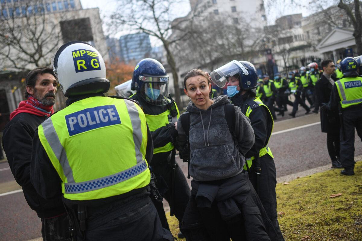 A woman is seen being arrested during a protest in London, on Nov. 28, 2020. (Peter Summers/Getty Images)