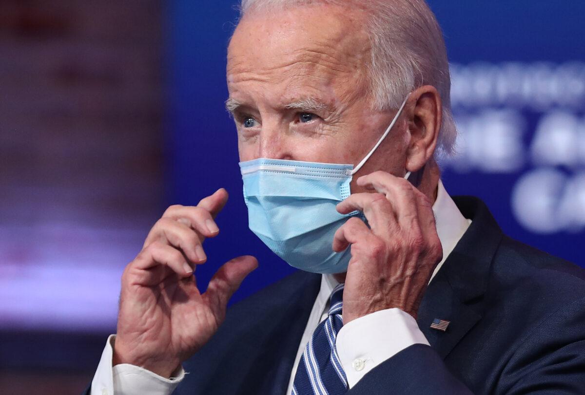 Joe Biden removes his mask to address the media at the Queen Theater in Wilmington, Del. on Nov. 10, 2020. (Joe Raedle/Getty Images)