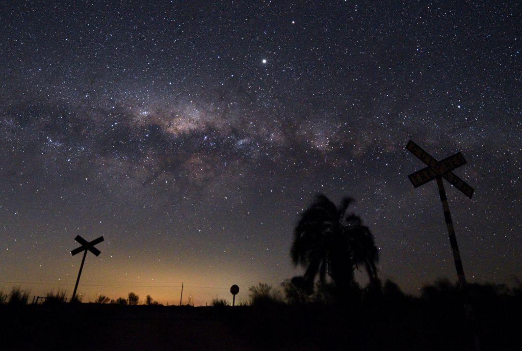 The Milky Way's galactic center and Jupiter (brightest spot at center top) are seen from the countryside near the small town of Reboledo, department of Florida, Uruguay (MARIANA SUAREZ/AFP via Getty Images)