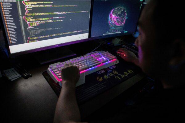 A member of the hacking group Red Hacker Alliance is monitoring global cyberattacks at their office in Dongguan, China's southern Guangdong Province, on Aug. 4, 2020. (Nicolas Asfouri/AFP via Getty Images)