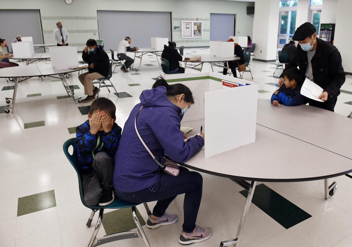 Voters cast their ballots at a polling station on election day in Arlington, Va., on Nov. 3, 2020. (Olivier Douliery/AFP via Getty Images)