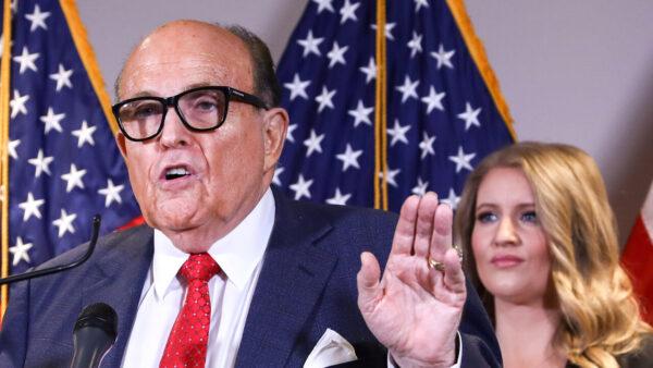 President Donald Trump's lawyer and former New York Mayor Rudy Giuliani speaks to the media while flanked by Trump campaign senior legal adviser Jenna Ellis (R) at a press conference at the Republican National Committee headquarters on Nov. 19, 2020. (Charlotte Cuthbertson/The Epoch Times)
