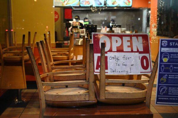 Employees work in a restaurant open for to-go or delivery orders only, in Burbank, Calif., on Nov. 23, 2020. (Robyn Beck/AFP via Getty Images)