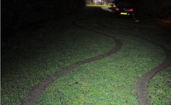 The tyre tracks across the grass verge, where a police officer was dragged in Chafford Hundred, Essex, UK, on Jan. 14, 2020. (Essex Police)