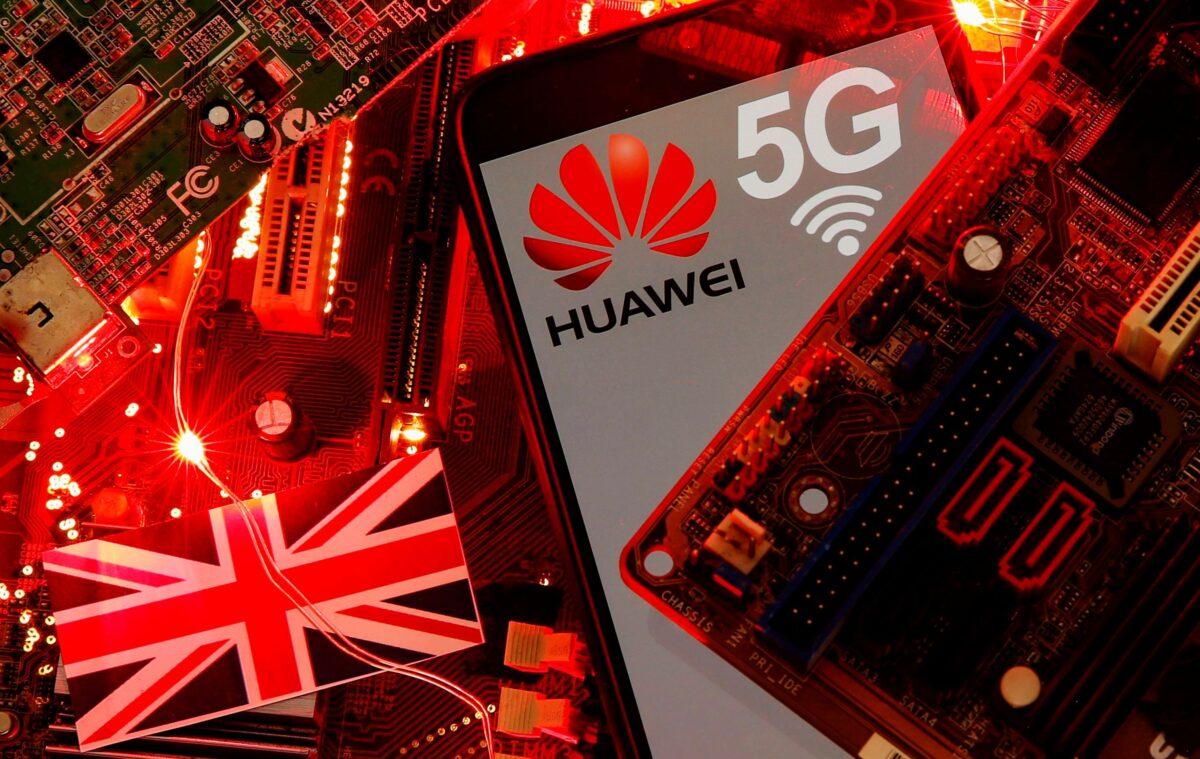 The British flag and a smartphone with a Huawei and 5G network logo are seen on a PC motherboard in this illustration picture taken Jan. 29, 2020. (Dado Ruvic/Reuters)