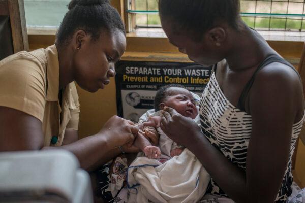 A nurse administers a vaccine to a child at Ewin Polyclinic in Cape Coast on April 30, 2019. (Cristina Aldehuela/AFP via Getty Images)