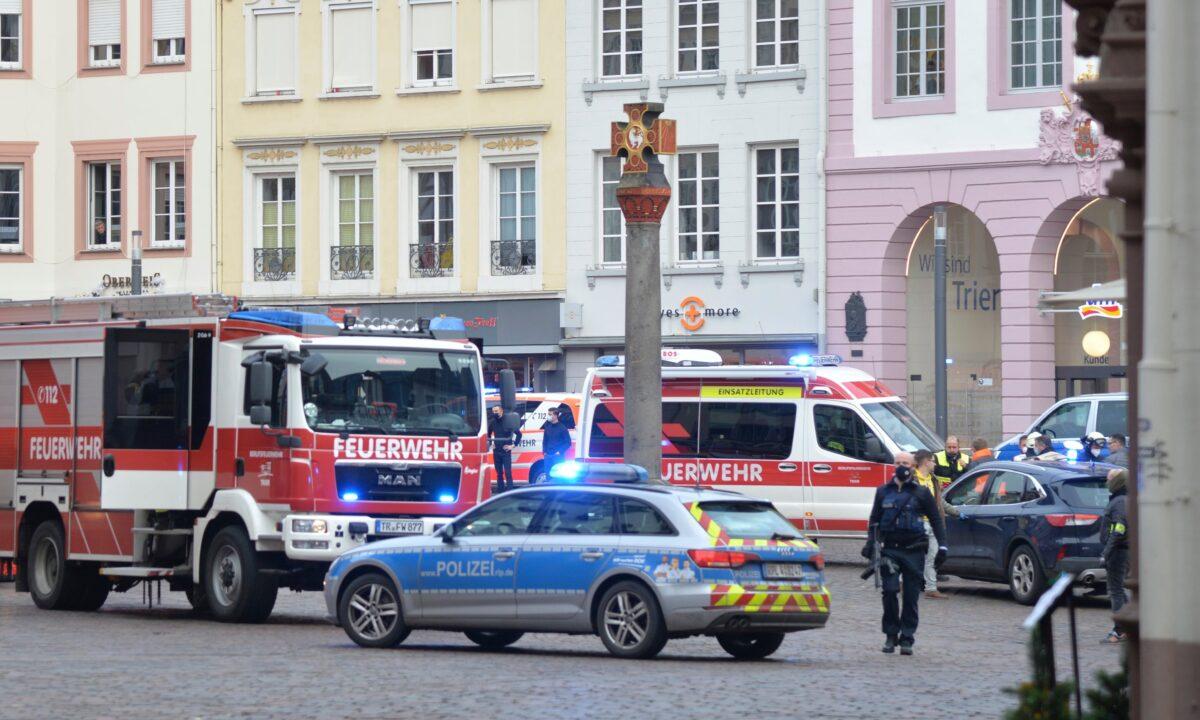 German police block a square after a driver drove into a pedestrian zone killing two and seriously injuring 15 in Trier, German, on Dec. 1, 2020. (Harald Tittel/dpa via AP)
