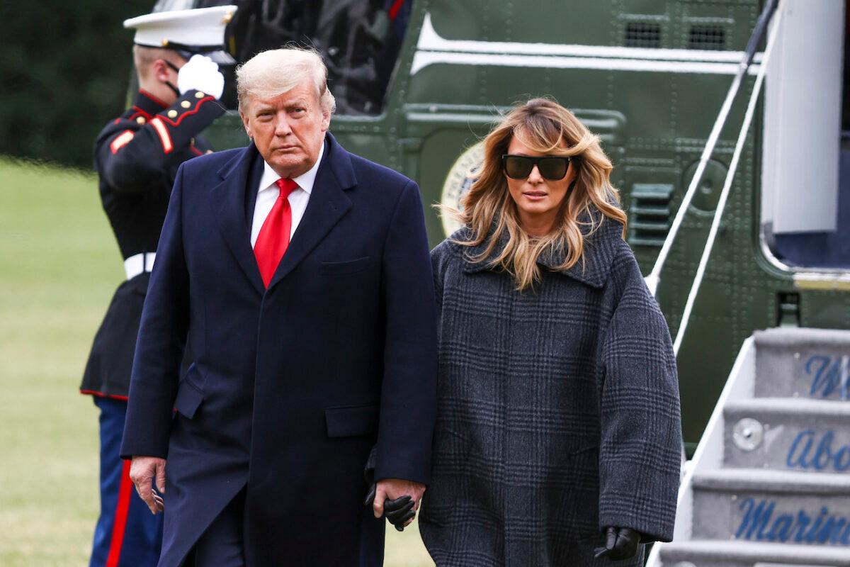 President Donald Trump and First Lady Melania Trump depart Marine One on the South Lawn of the White House in Washington on Dec. 31, 2020. (Tasos Katopodis/Getty Images)