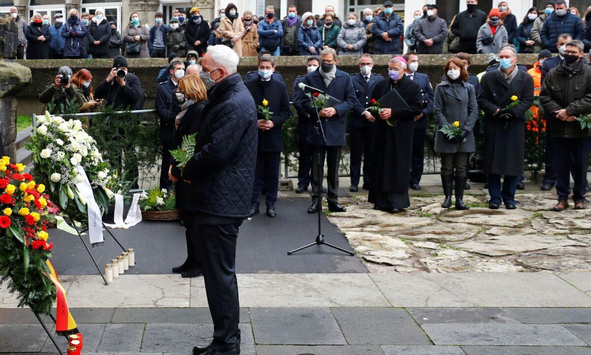 Prime Minister at State of Rhineland-Palatinate Malu Dreyer and Mayor of Trier Wolfram Leibe pay their respects near the site where a car crashed into pedestrians, in Trier, Germany, on Dec. 2, 2020. (Kai Pfaffenbach/Reuters)