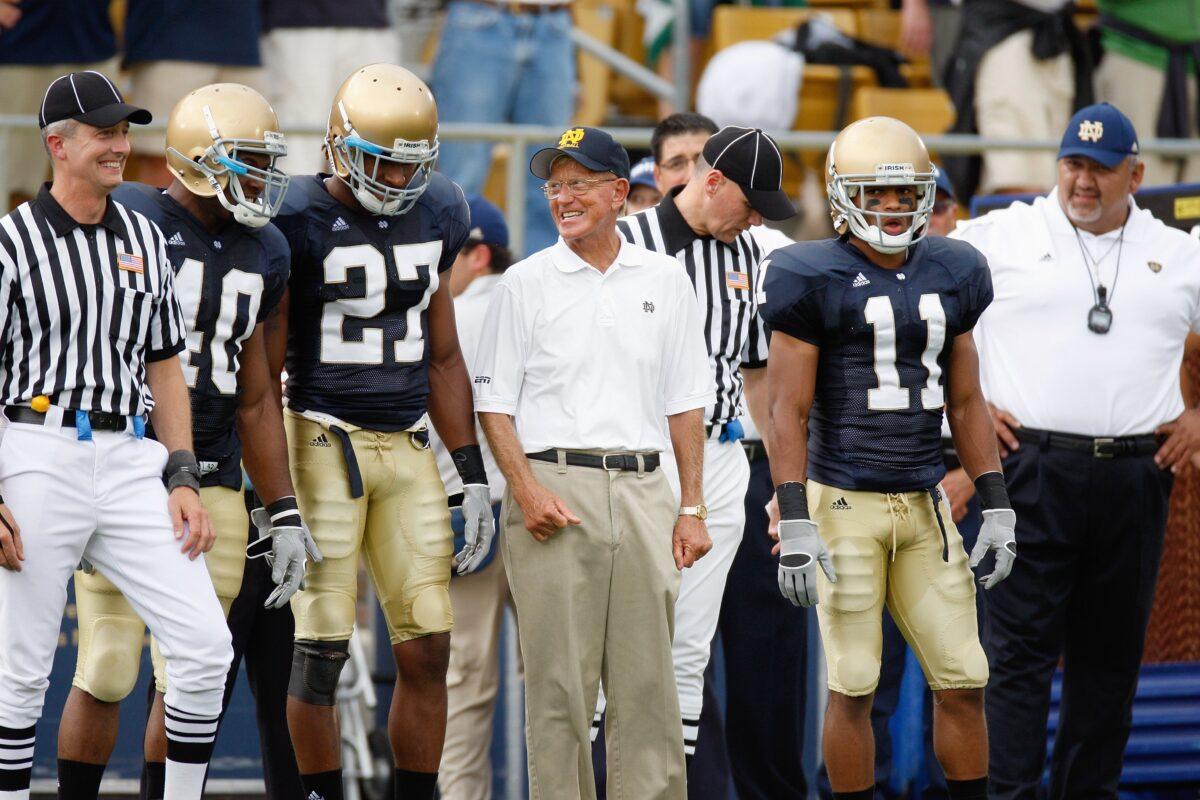 Former head coach Lou Holtz of the Notre Dame Fighting Irish stands with players before a game in South Bend, Ind., on Sept. 13, 2008. (Gregory Shamus/Getty Images)