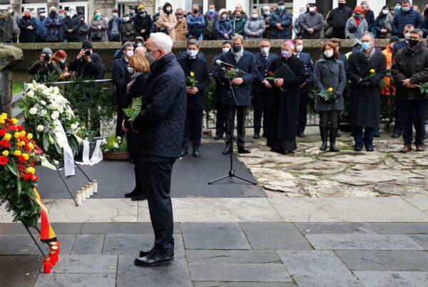 Prime Minister at State of Rhineland-Palatinate Malu Dreyer and Mayor of Trier Wolfram Leibe pay their respects near the site where a car crashed into pedestrians, in Trier, Germany, on Dec. 2, 2020. (Kai Pfaffenbach/Reuters)