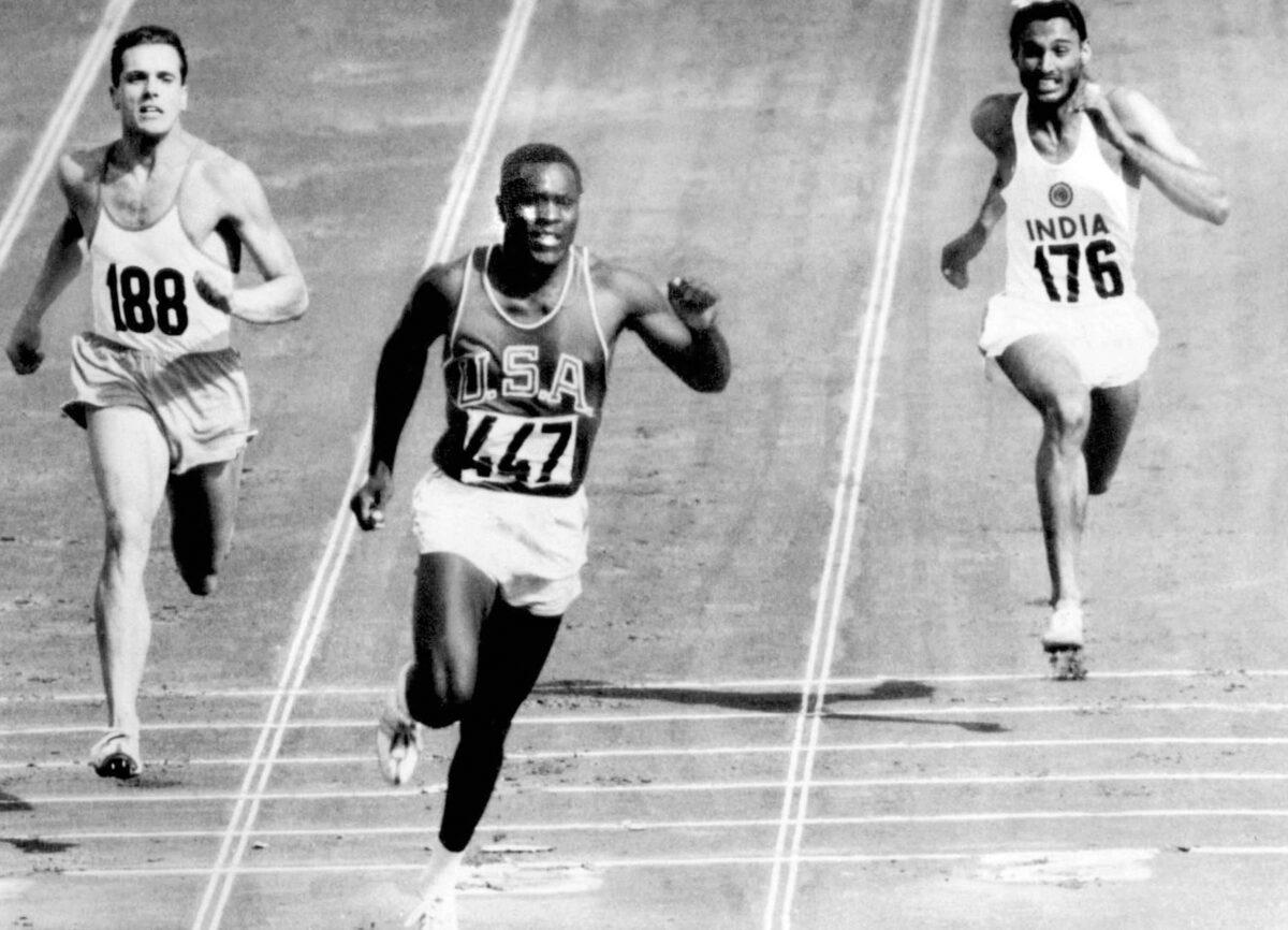 Rafer Johnson of the United States (C) finishes the fourth heat of the decathlon 100-meter (328 foot) dash at the Olympics in Rome, Italy, on Sept. 5, 1960. (Olympic Pool/AP Photo)