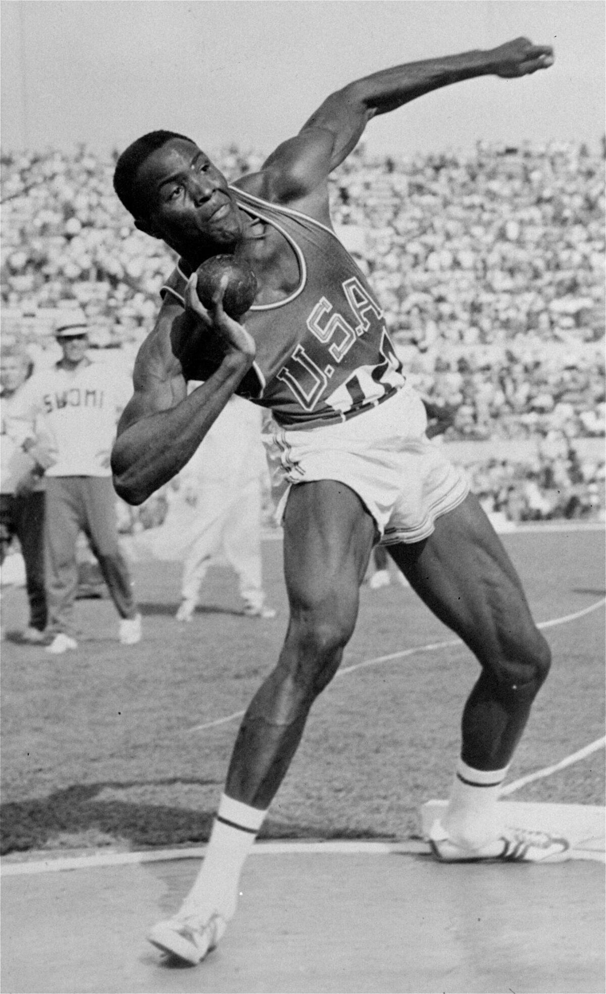 Rafer Johnson competes in the shot put event of the Olympic decathlon competition in Rome, Italy, on Sept. 5, 1960. (AP Photo)