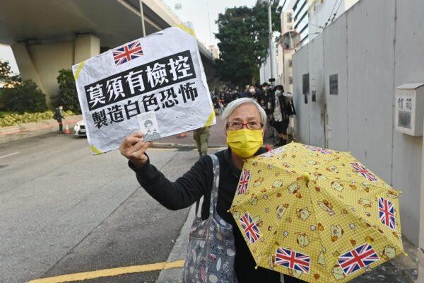 Hong Kong activist Alexandra Wong offers support for fellow activists outside of the West Kowloon Magistrates Court in Hong Kong on Dec. 2, 2020. (Song Bilung/The Epoch Times)