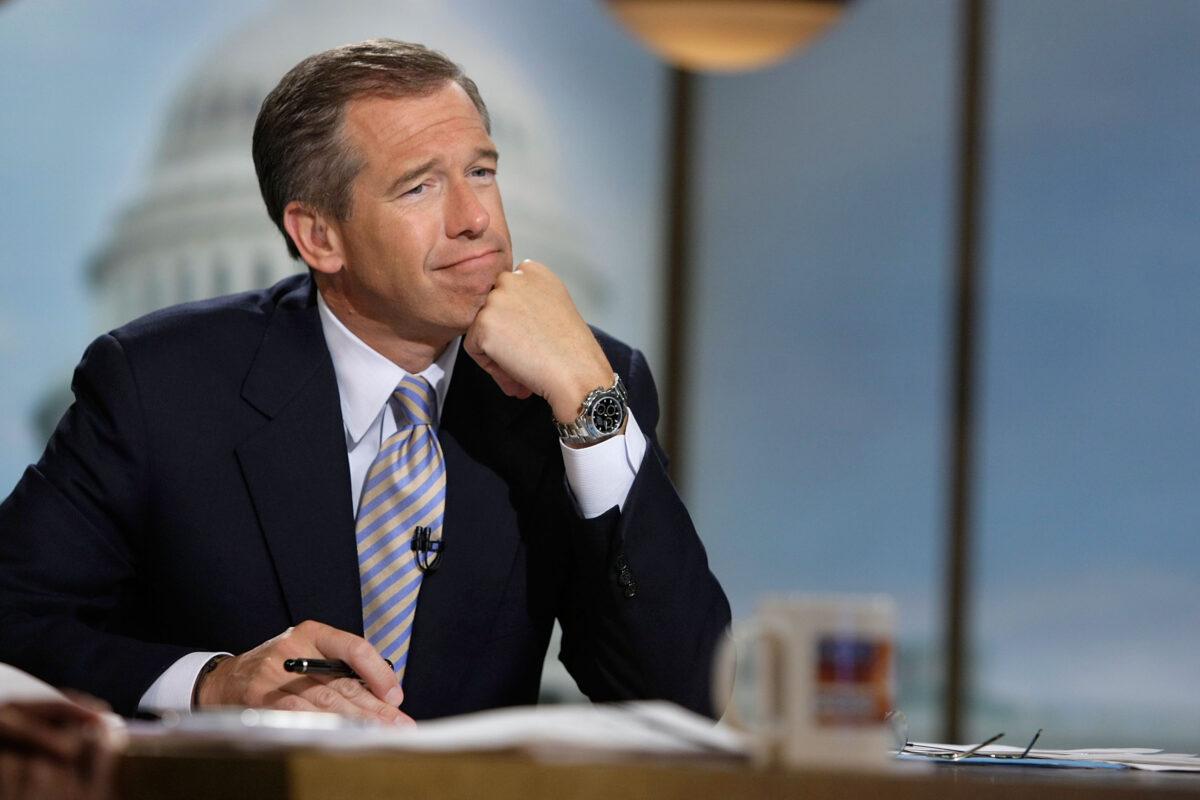 Moderator Brian Williams watches a video during a taping of "Meet the Press" at the NBC studios in Washington, on June 22, 2008. (Alex Wong/Getty Images for Meet the Press)