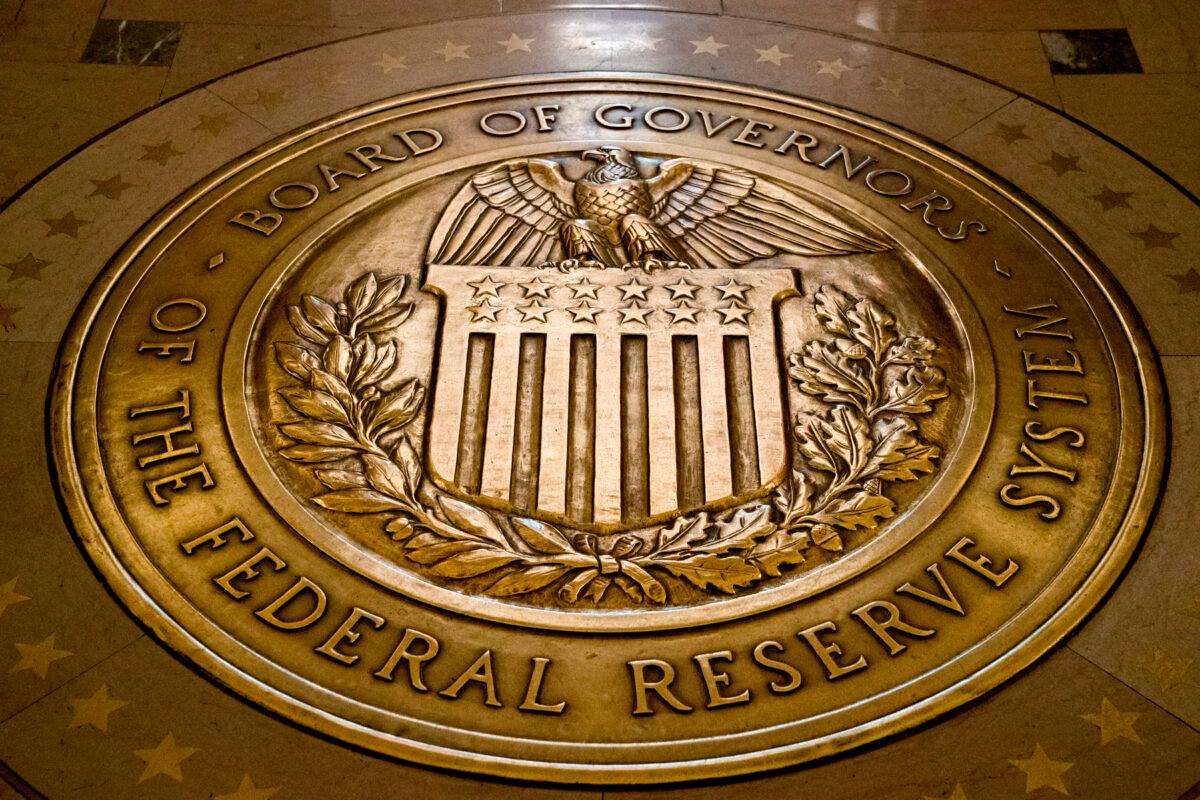 This Feb. 5, 2018, file photo shows the seal of the Board of Governors of the United States Federal Reserve System in the ground at the Marriner S. Eccles Federal Reserve Board Building in Washington. (Andrew Harnik, File/AP Photo)