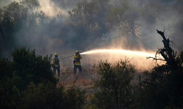 Firefighters battle the Bond Fire in Silverado Canyon in Orange County, Calif., on Dec. 3, 2020. (John Fredricks/The Epoch Times)