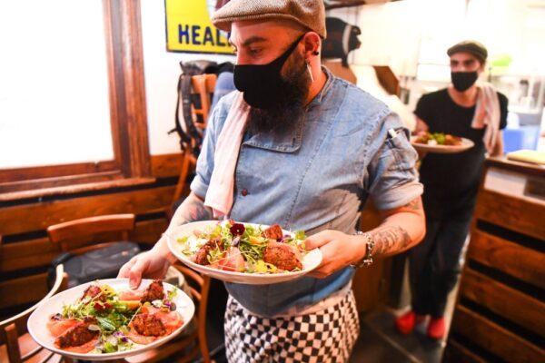 Mandatory mask rule in restaurants is scrapped as of midnight Dec. 6. Tiamo Bistro in Melbourne, Victoria, Australia on Oct. 27, 2020. (William West/AFP via Getty Images)
